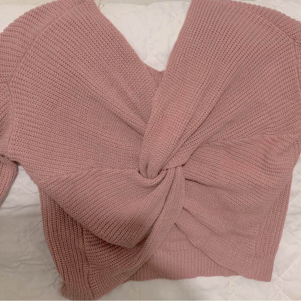 The sweater has been used is in good condition loose fit cute in a large.